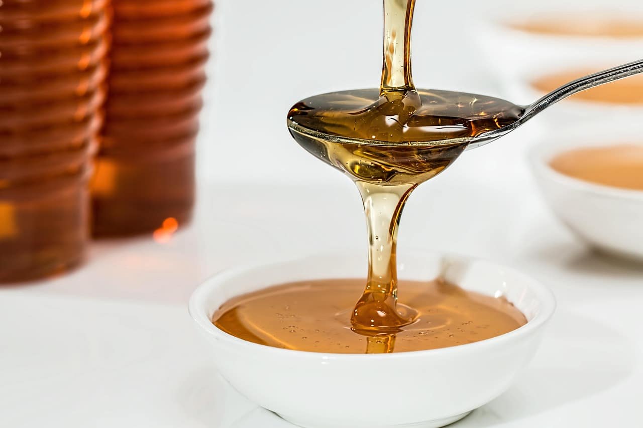 honey pouring spoon honey pouring spoon